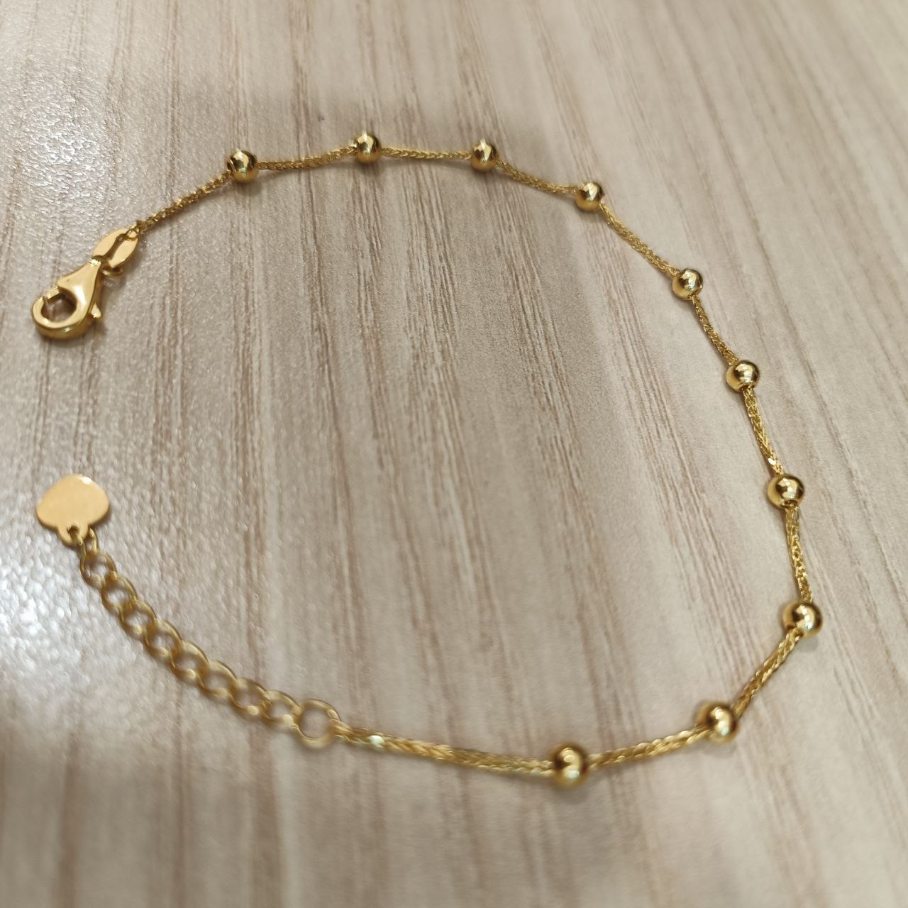 Polished bead stations on an adjustable 916 gold bracelet