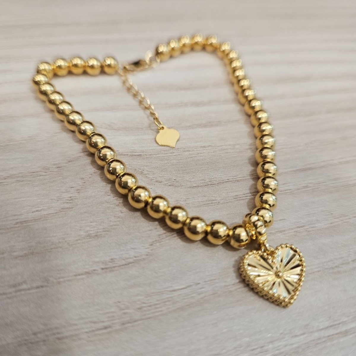 916 Gold Bead Bracelet with Dangling Cutting Heart DesignBraceletsBest Gold Shop