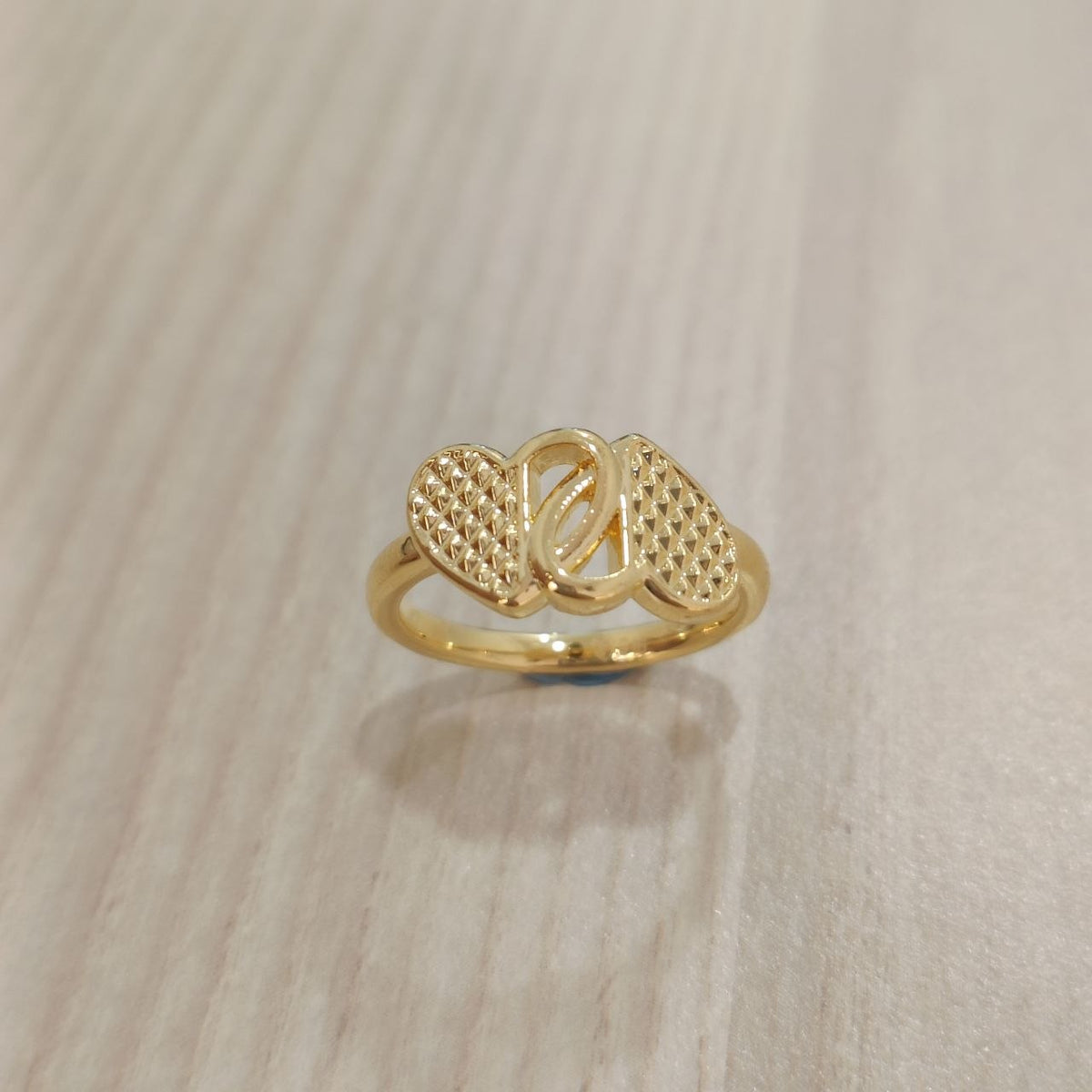 Front view of 916 gold cross heart ring