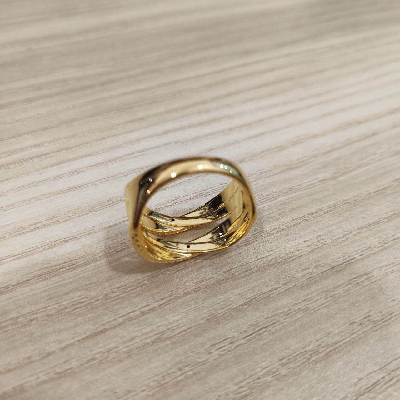 Angled view of lightweight 916 gold double cross wide ring