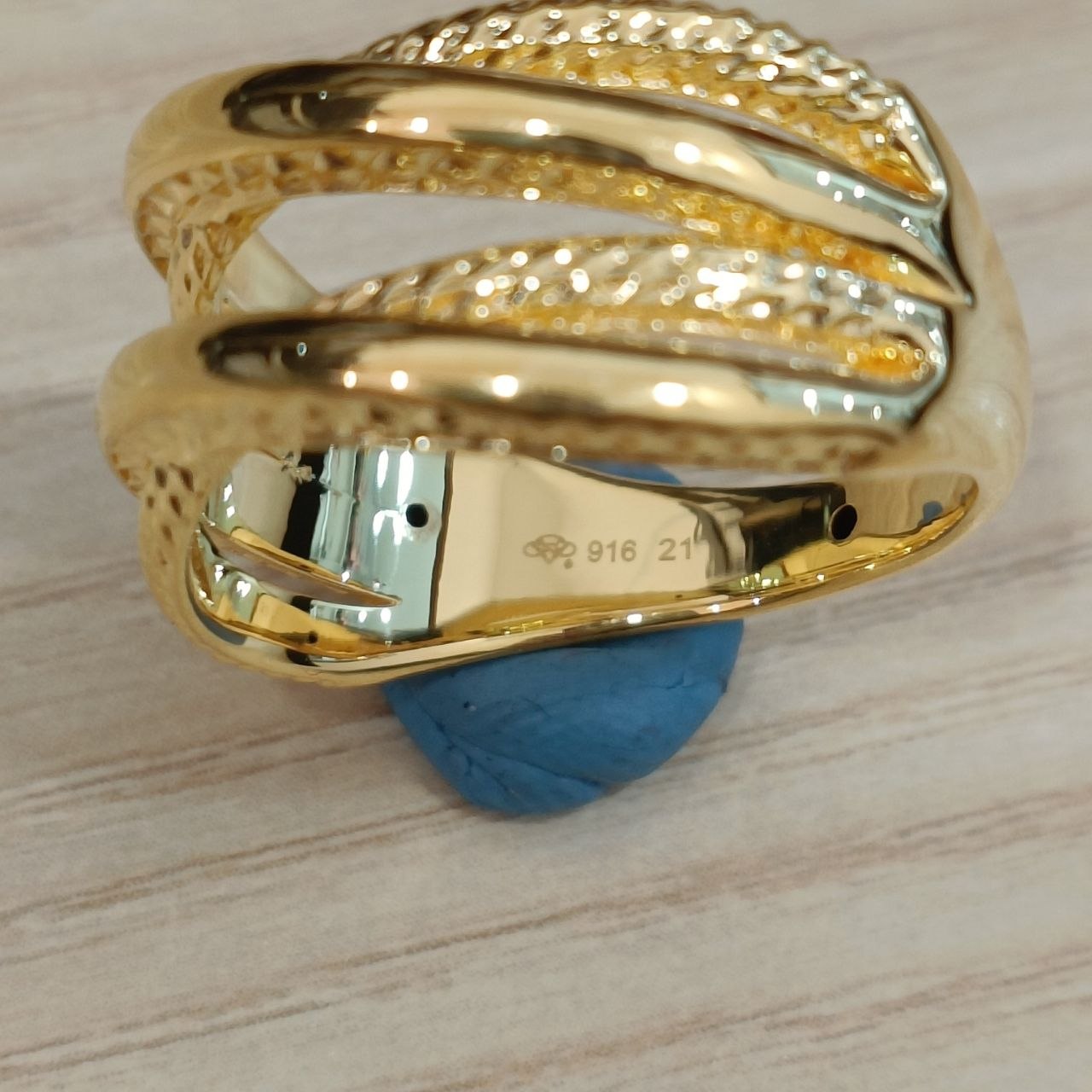 Full view of lightweight 916 gold double cross wide ring