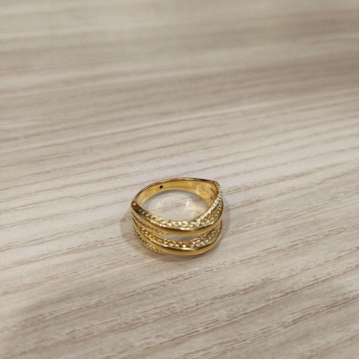 Side view of polished 916 gold double cross wide ring