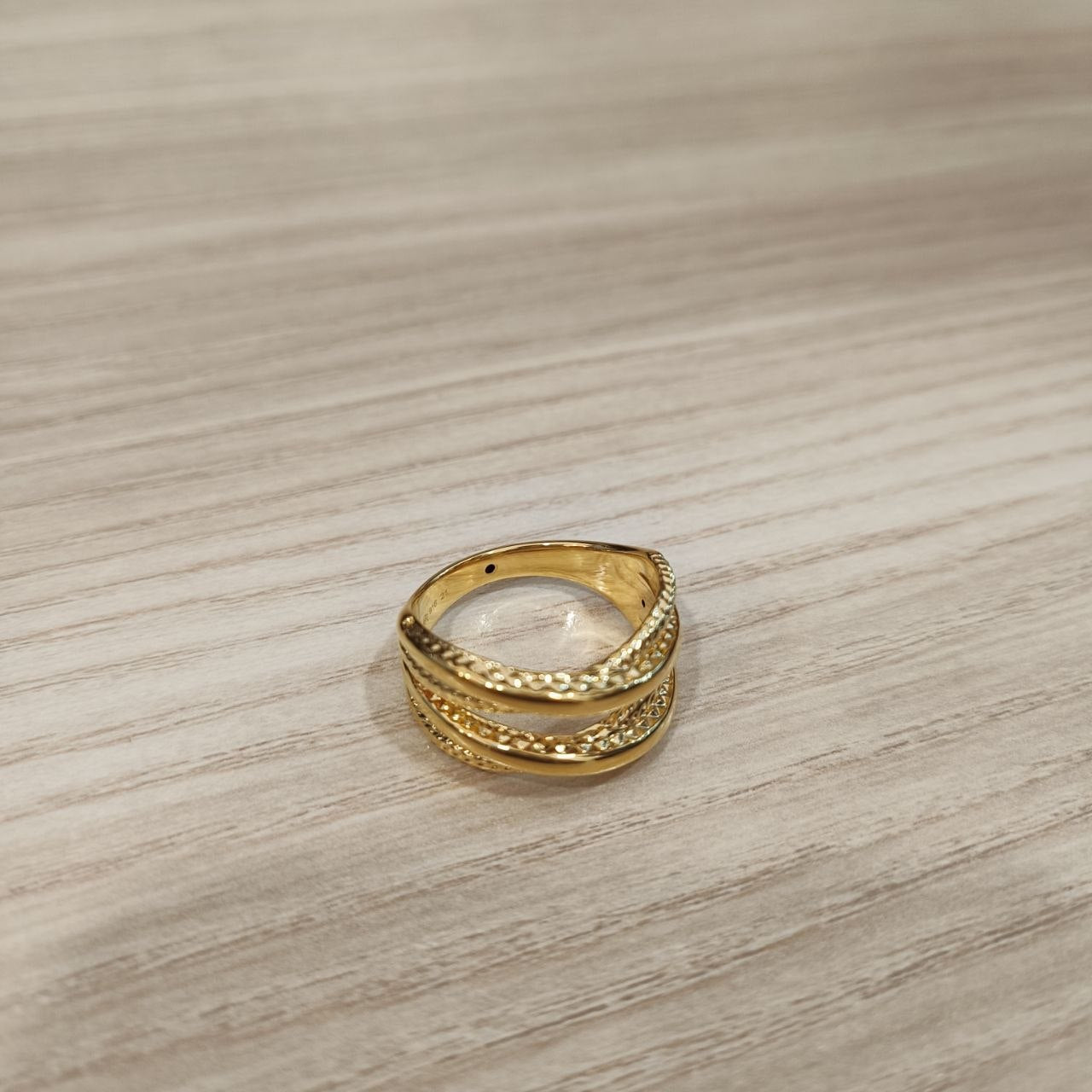Side view of polished 916 gold double cross wide ring