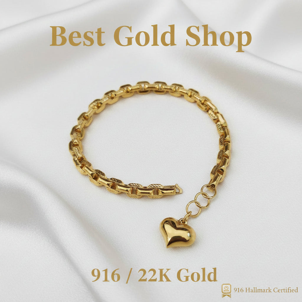 Polished 22K gold heart charm on the Wanzi link bracelet