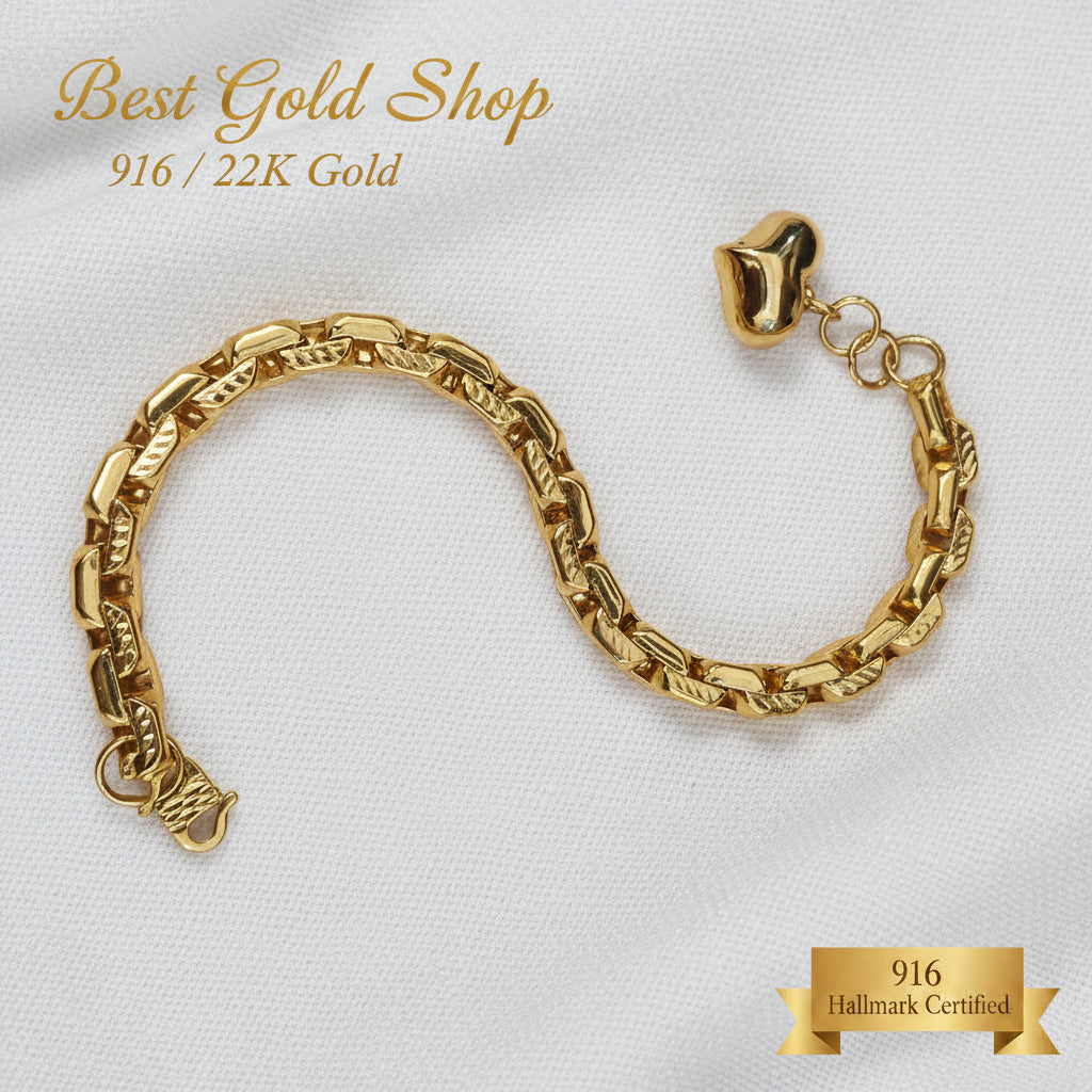 Detailed view of the textured gold links and dangling heart charm