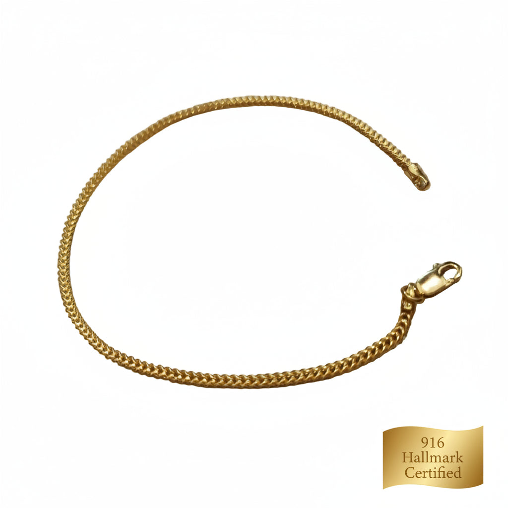 Close-up of polished 916 gold hollow box bracelet links