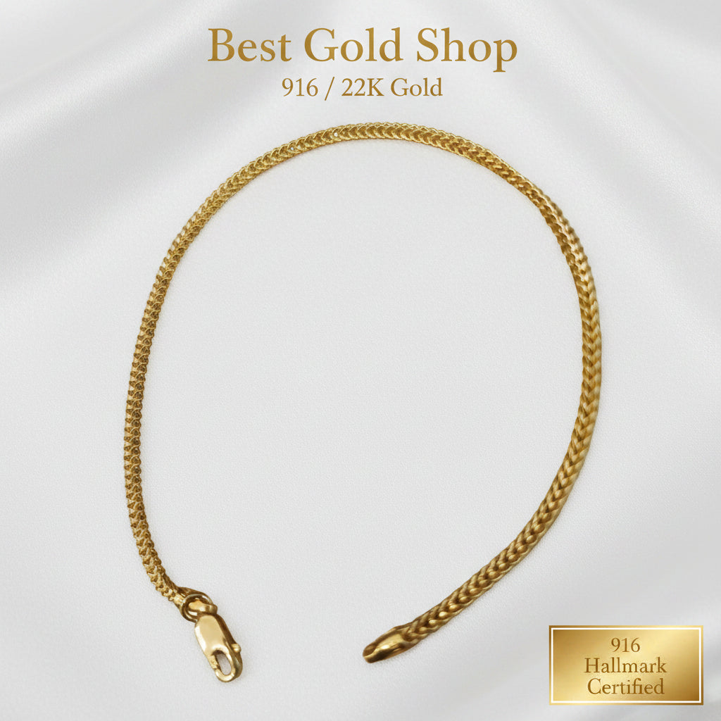 Side view of polished 916 gold hollow box bracelet