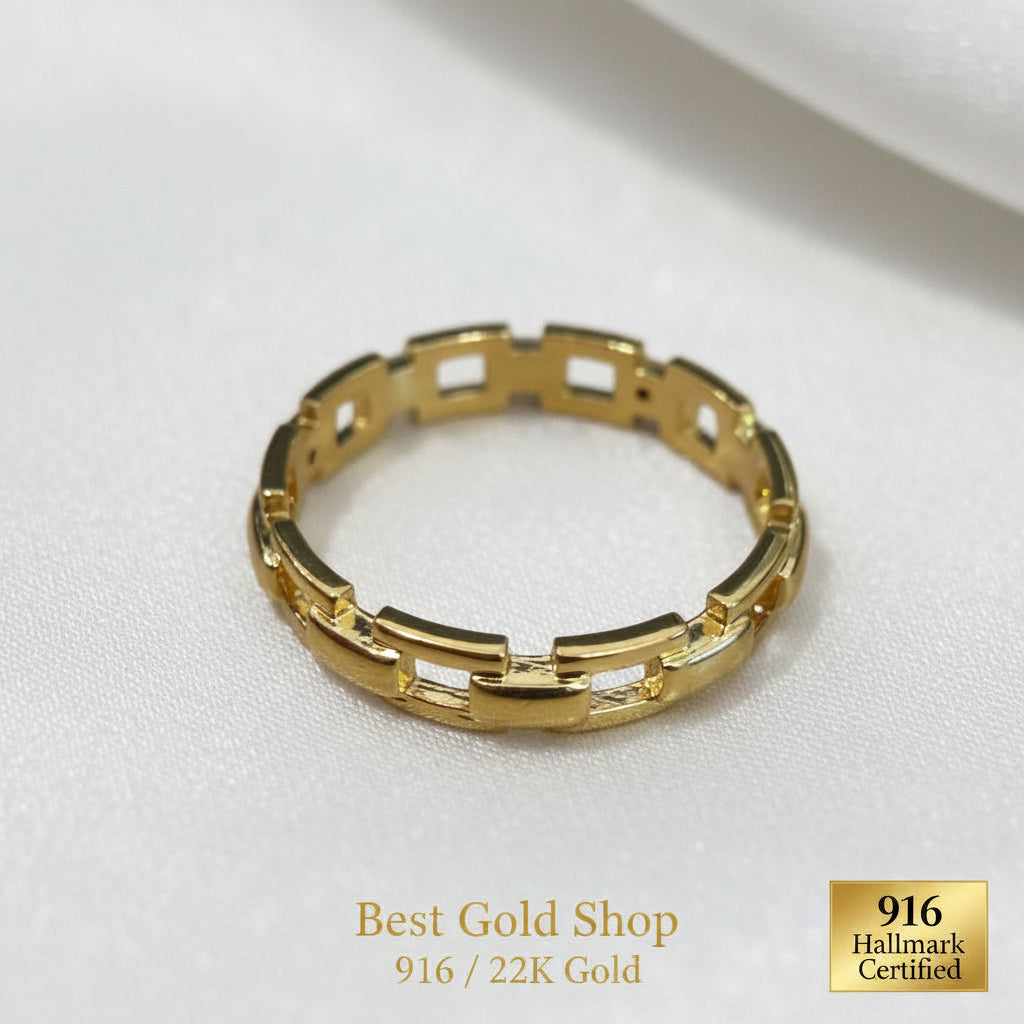 916 gold chain-link ring photographed at an angle on white satin