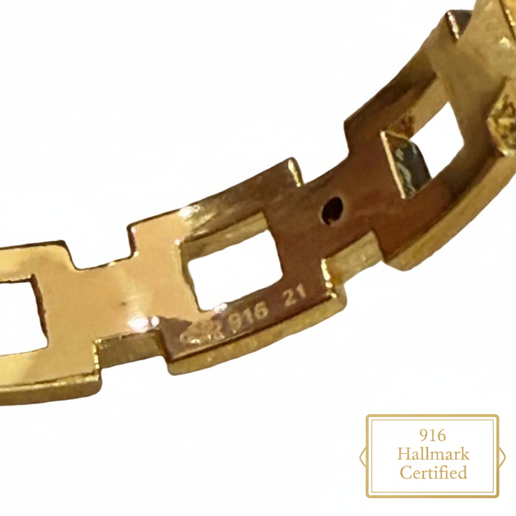 Close-up of hallmark and size markings on the 916 gold chain-link ring