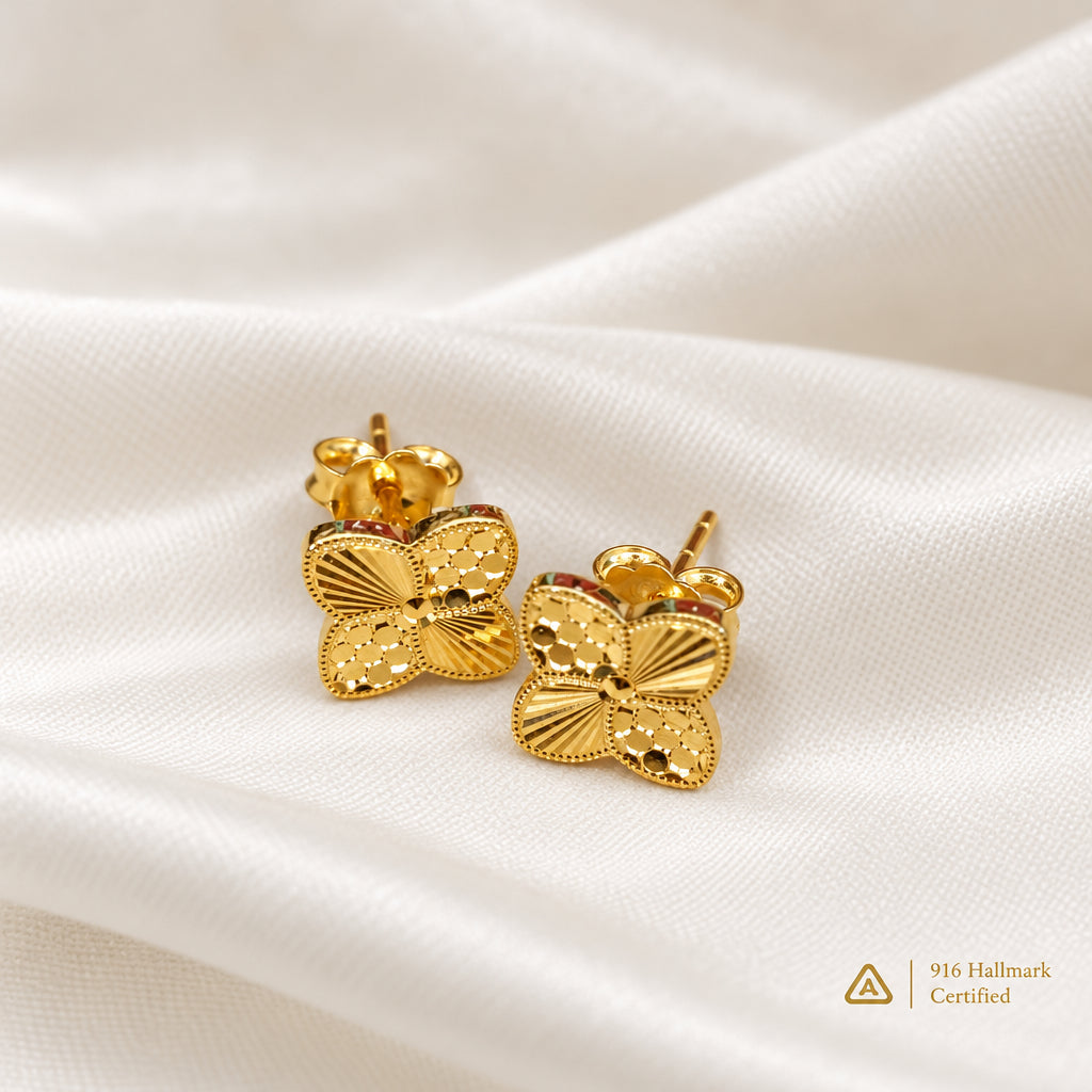 916 gold petal earrings displayed together on light fabric