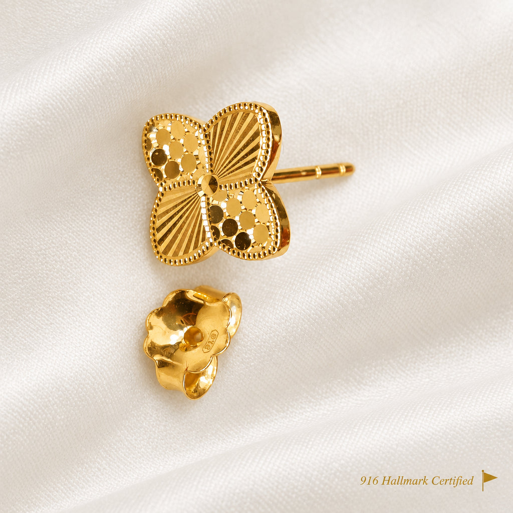 916 gold petal earring with separate backing on light fabric