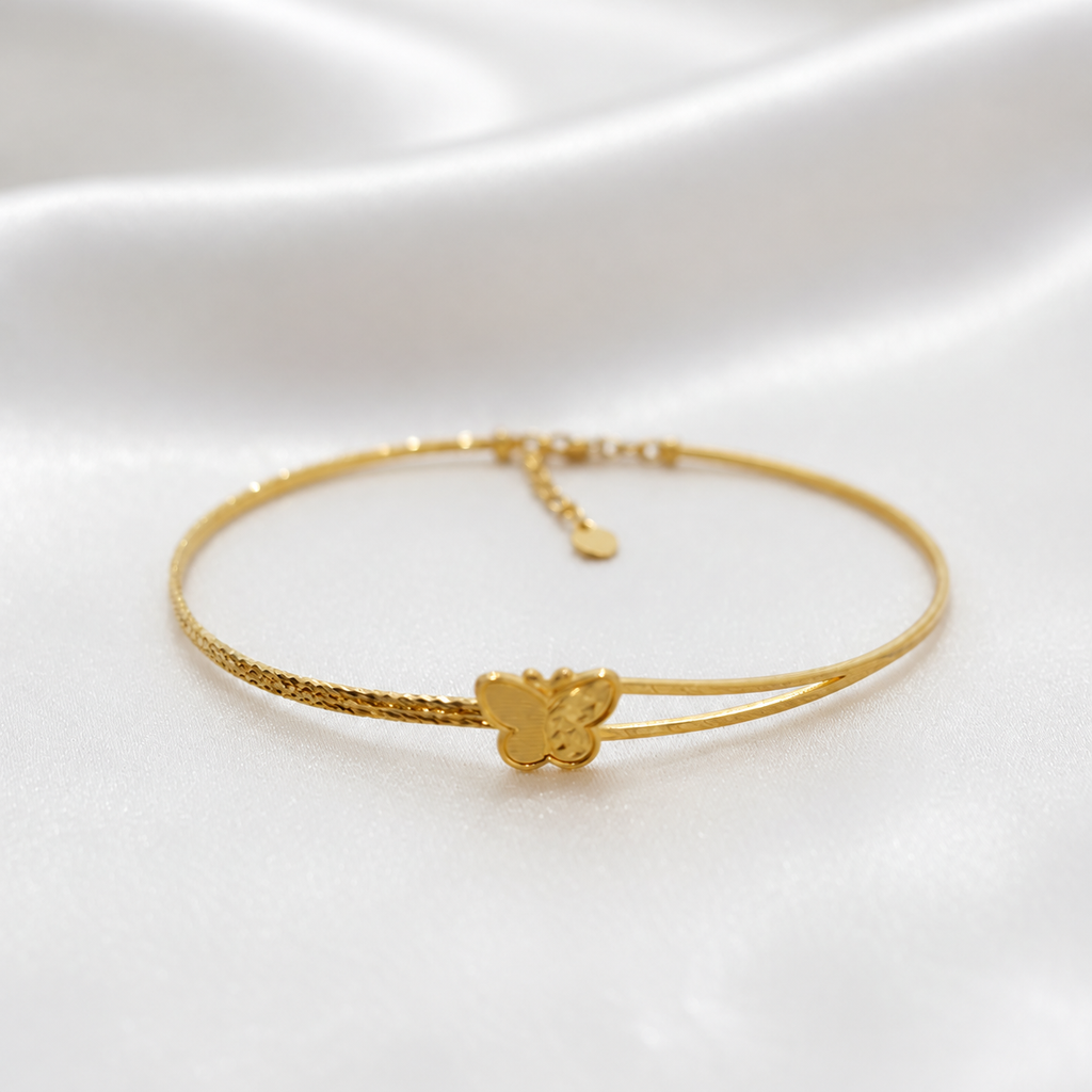 916 gold slim butterfly bangle on white satin