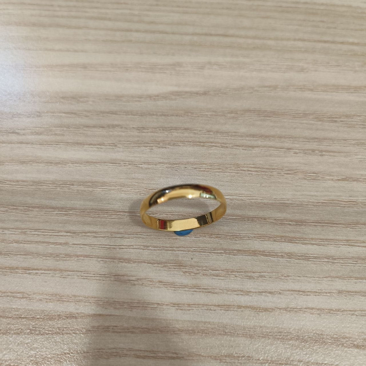 Front view of 916 gold slim plain polished band ring