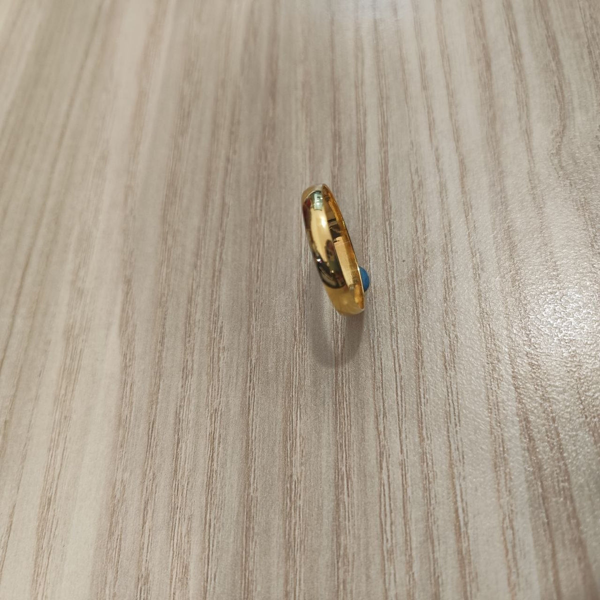 Side view of 916 gold slim plain polished band ring