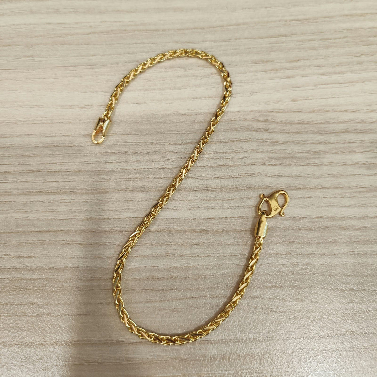 Full view of the 916 gold Spike bracelet in 22K yellow gold