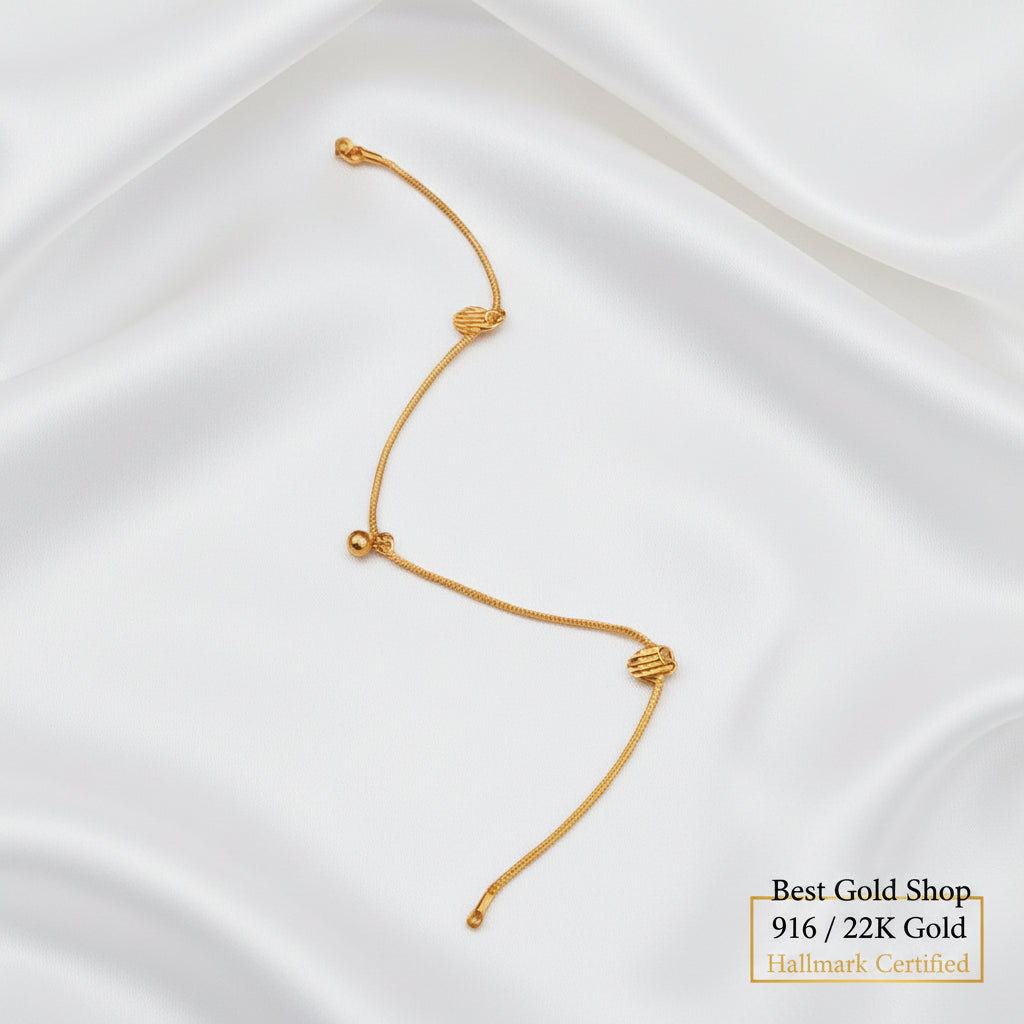 916 gold anklet with striped heart charms and a bell