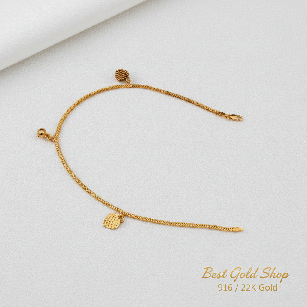 916 gold anklet with textured heart charms and a bell