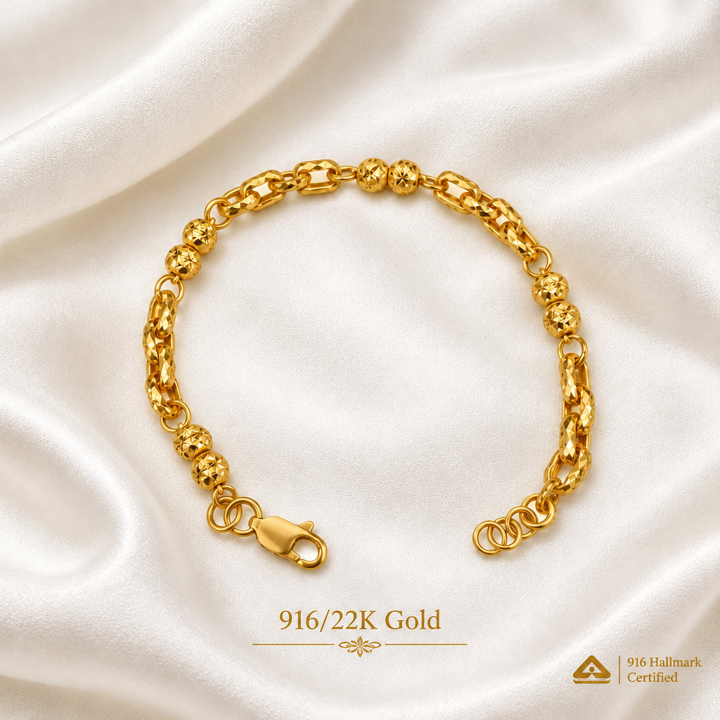 916 gold Wan Zi ball bracelet on light fabric