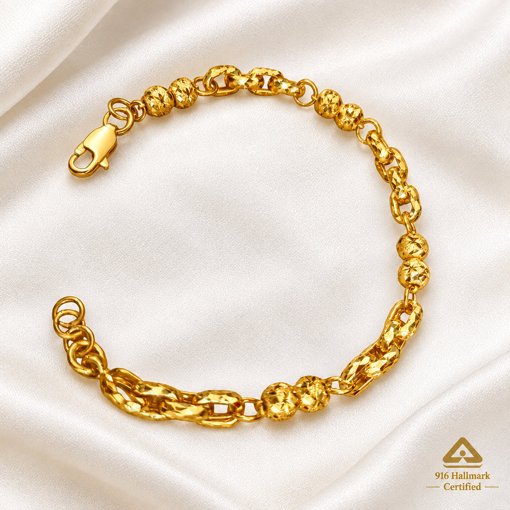 916 gold Wan Zi ball bracelet on light fabric