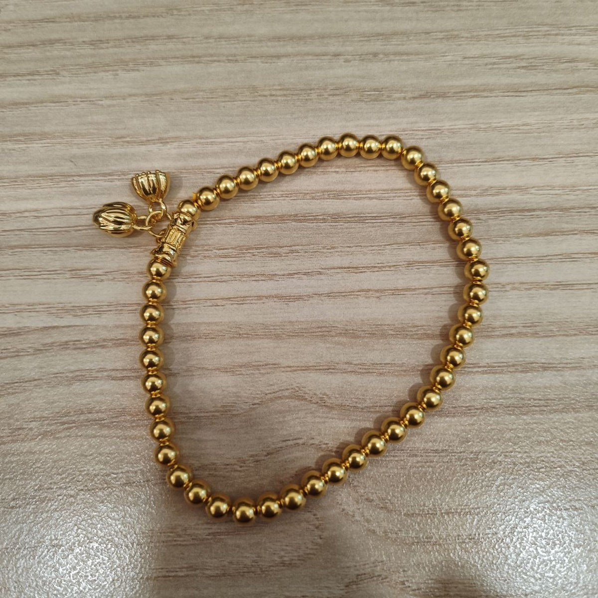 999 gold bead lotus bracelet in 24K yellow gold - full view