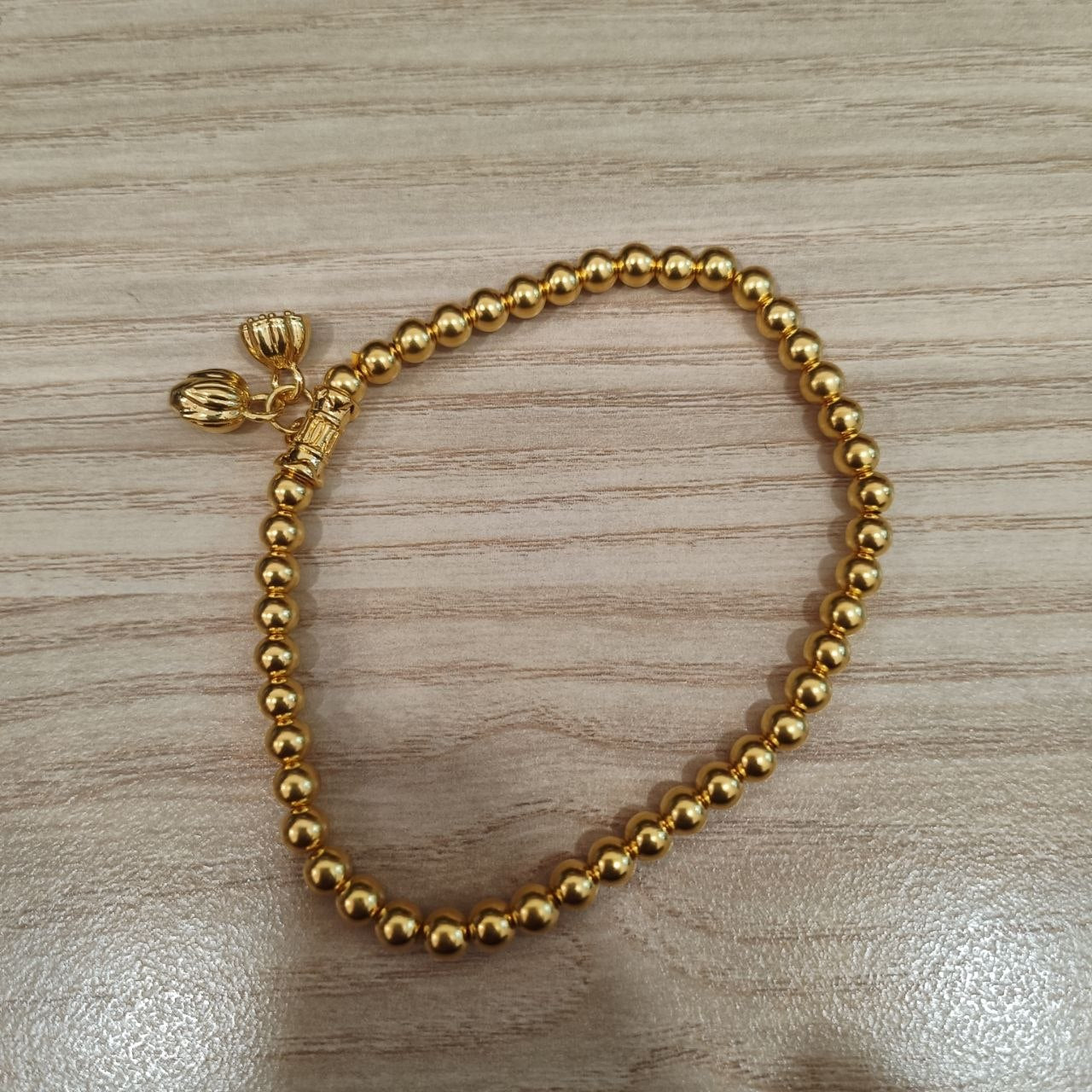 999 gold bead lotus bracelet in 24K yellow gold - full view