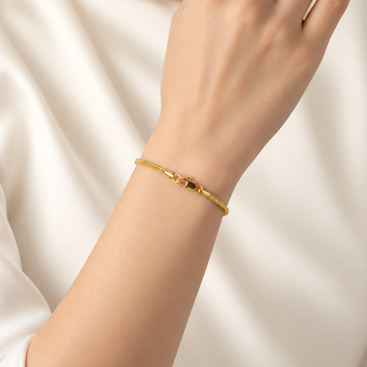 22K / 916 gold Hollow Box Bracelet worn on a wrist, showing its slim profile and lobster clasp