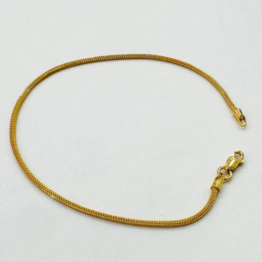 Original photo of the 4.44 g 916 gold dragon-link bracelet showing the full chain and lobster clasp