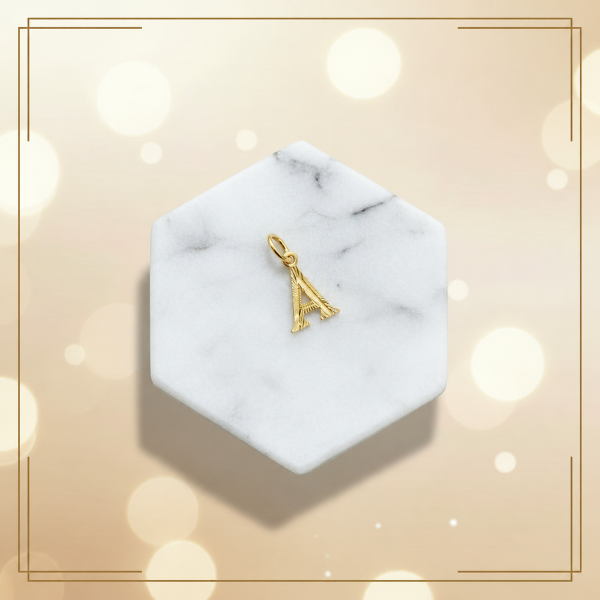 Guild Bullion 916 gold letter A pendant on a hexagonal marble display