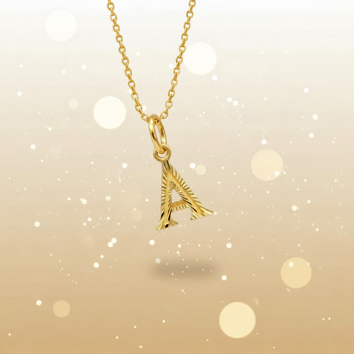 Guild Bullion 916 gold letter A pendant on a chain for styling reference; chain not included