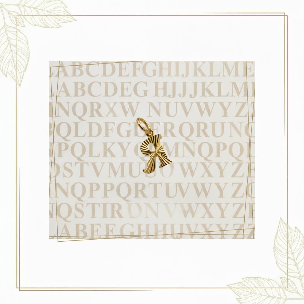 Guild Bullion 916 gold letter R pendant in reverse orientation on a decorative alphabet background
