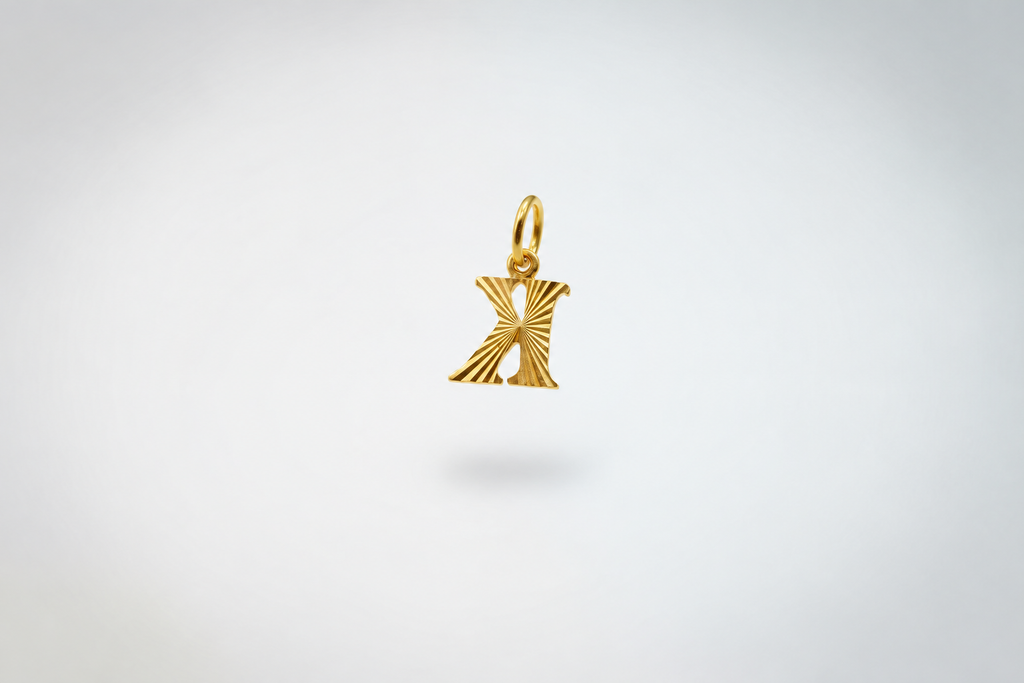 Guild Bullion 916 gold letter K pendant in reverse orientation as photographed on grey