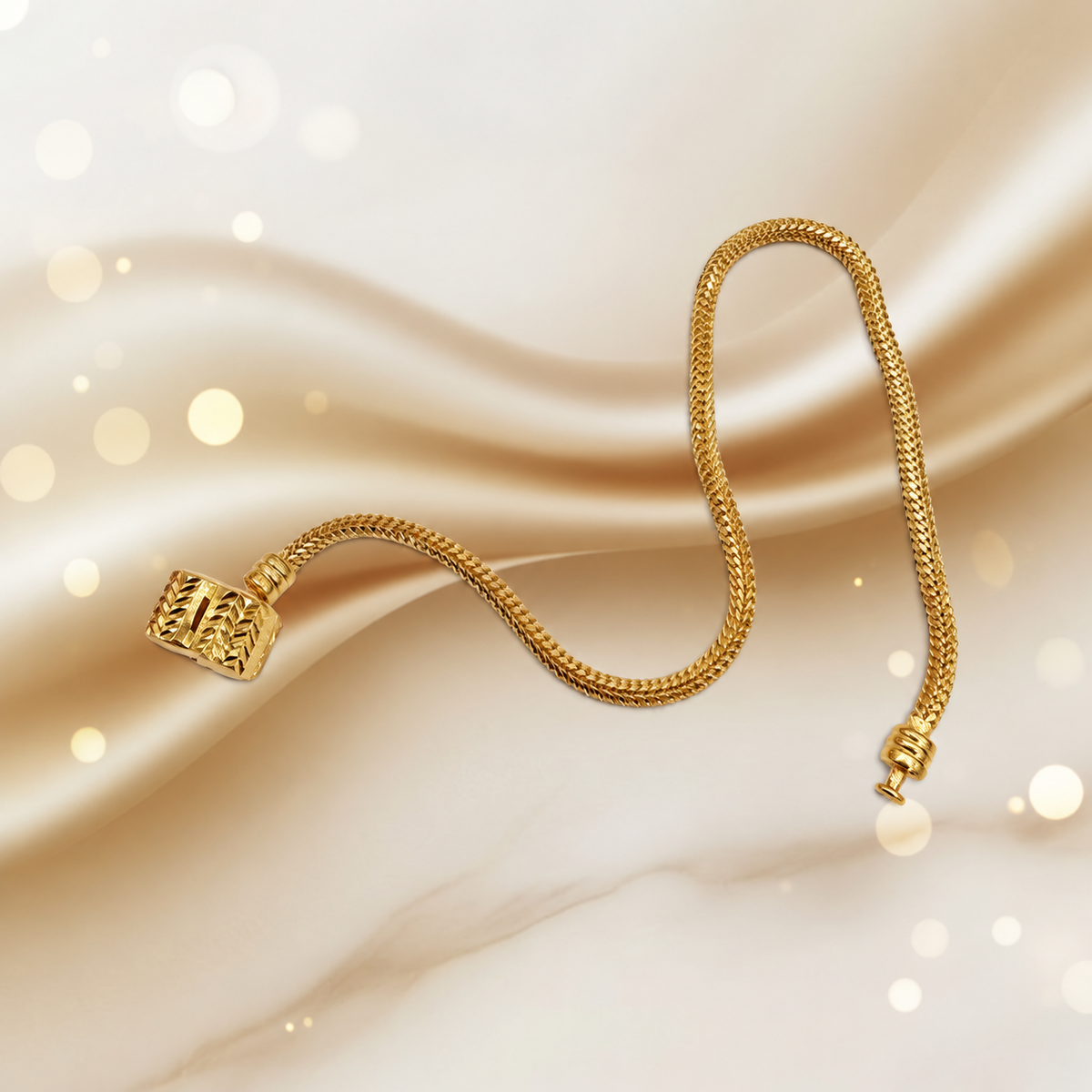 Guild Bullion 22K / 916 gold Charm-Cut Bracelet arranged in a flowing curve on satin with barrel clasp and terminal visible