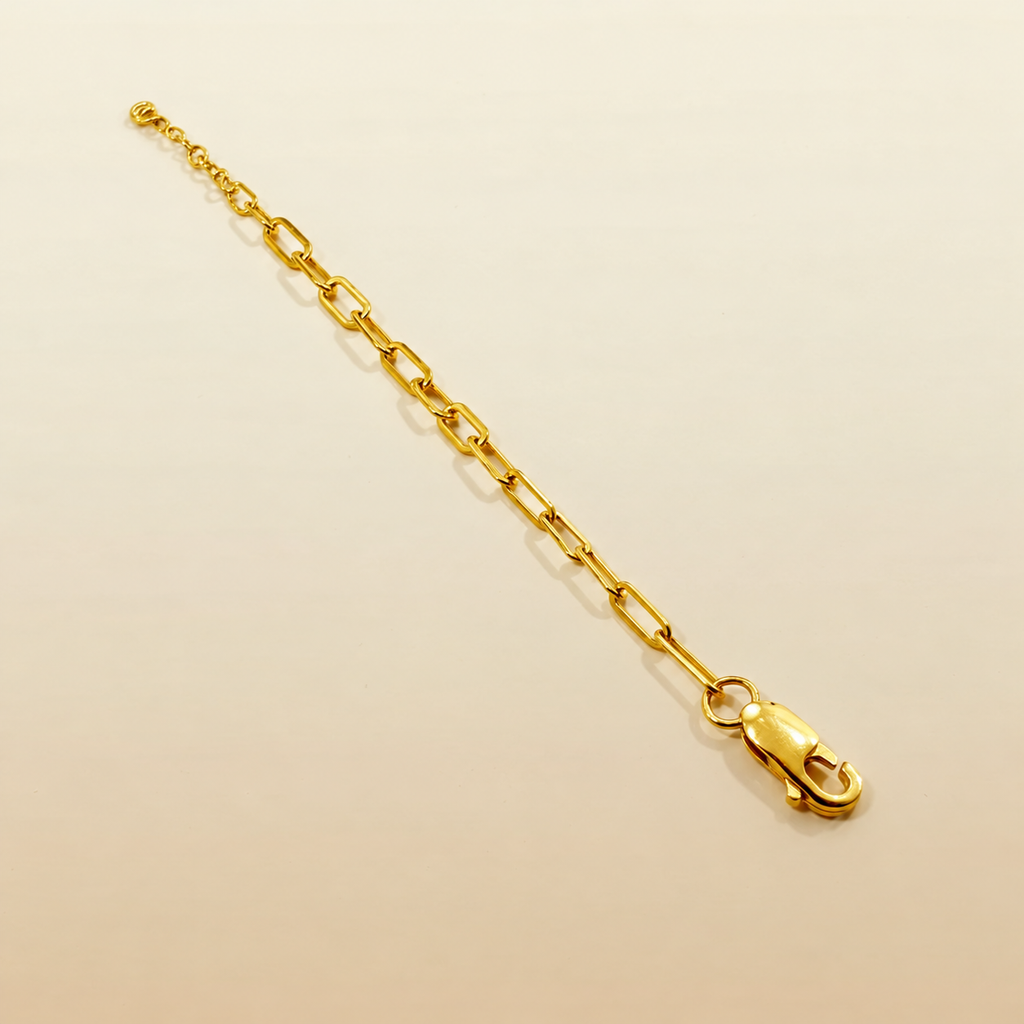 916 gold Clip Bracelet V3 on a cream background with lobster clasp and extension rings visible