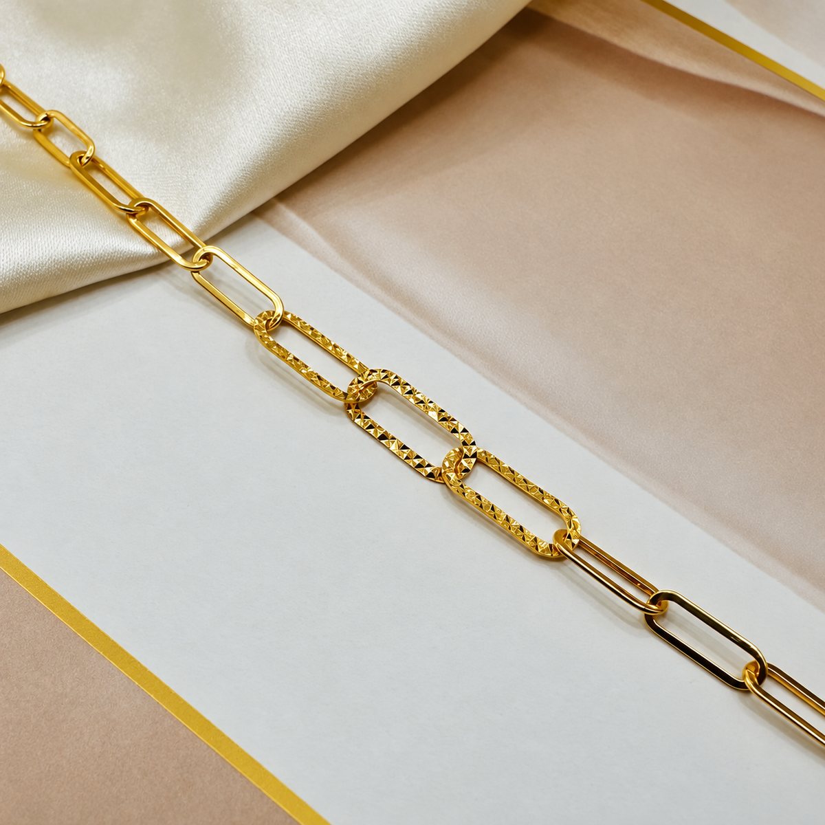 Close-up of three faceted centre links on the 22K gold Clip Bracelet V3