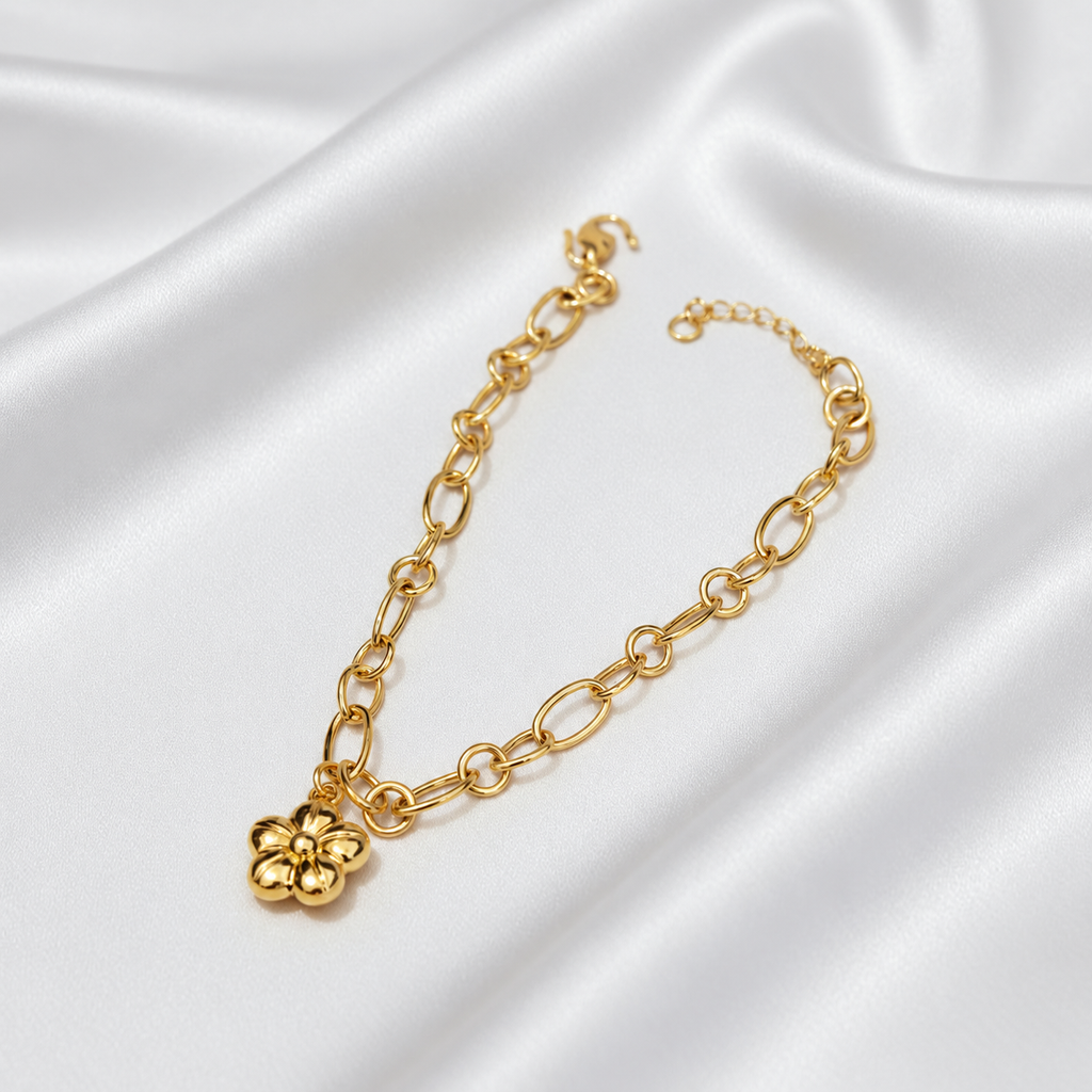 Full view of the 916 gold flower charm link bracelet with five-petal charm, lobster clasp and extension chain