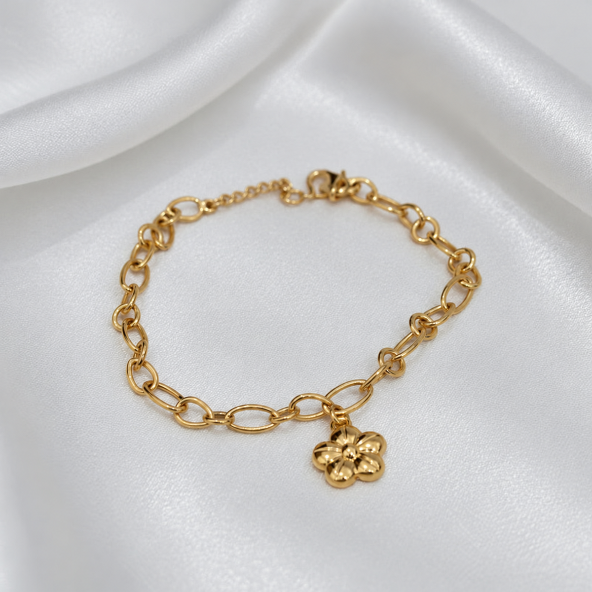 Oval arrangement of the 916 gold five-petal flower charm bracelet showing polished links and adjustable fastening