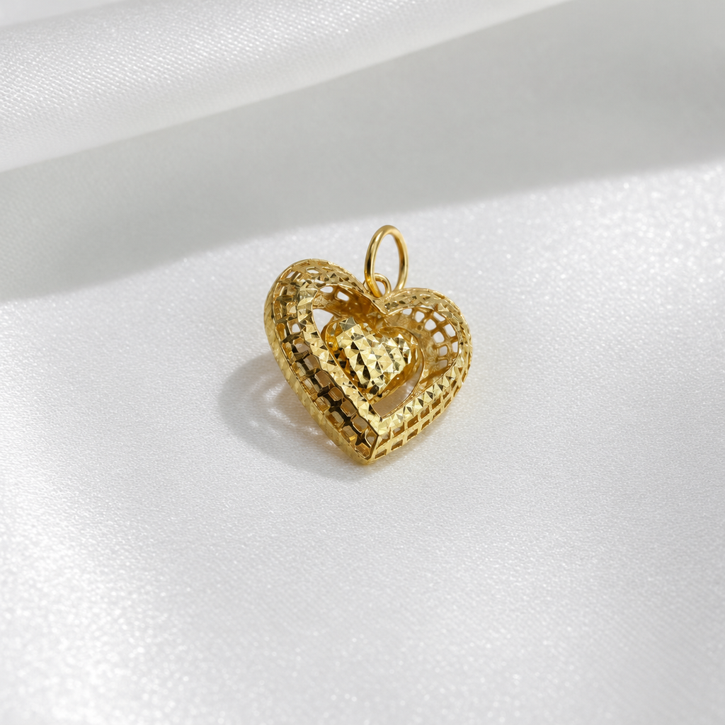 Angled view of the 916 gold dangling heart pendant showing the lattice frame and faceted inner heart