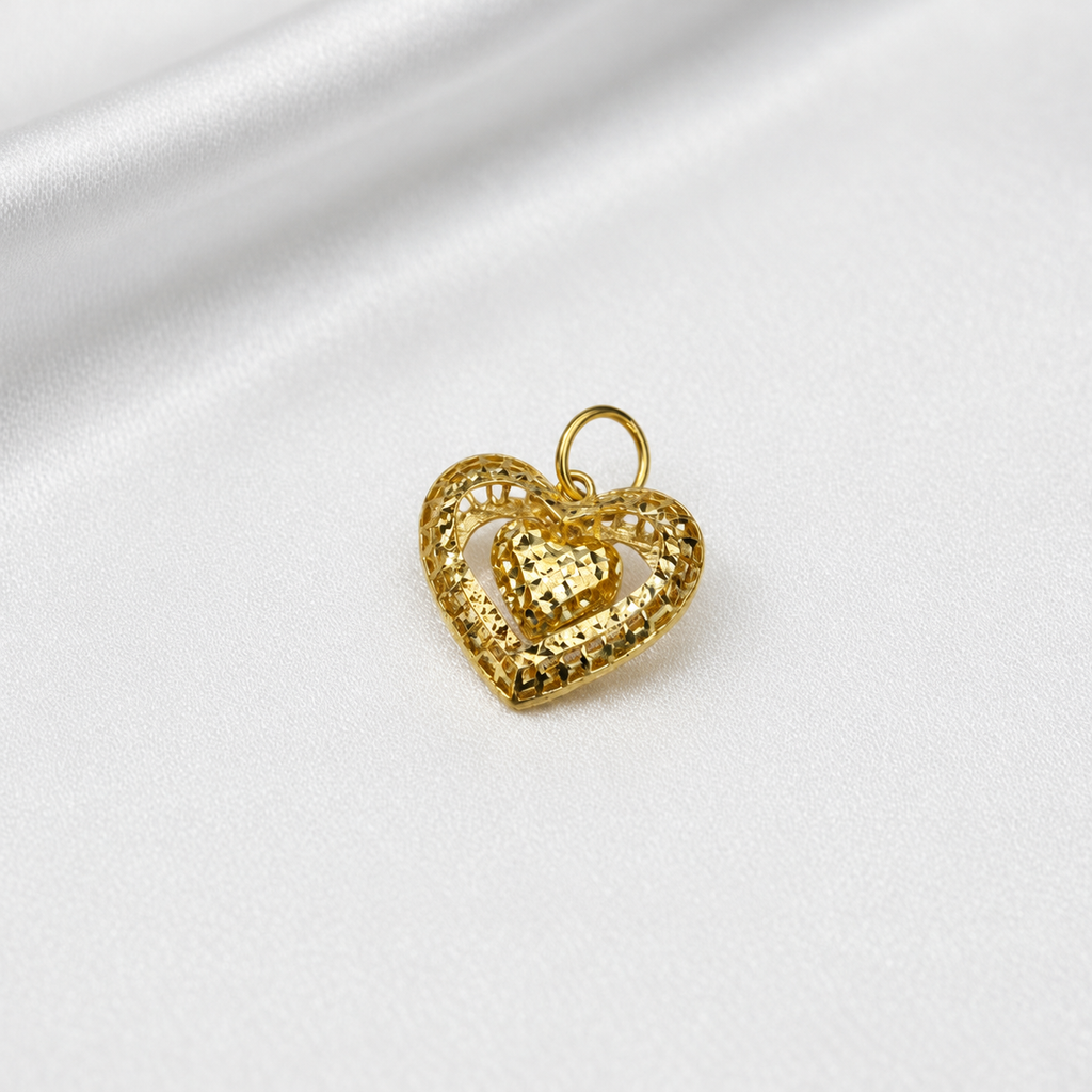 Upright front view of the 916 gold open heart pendant with a suspended faceted heart on satin