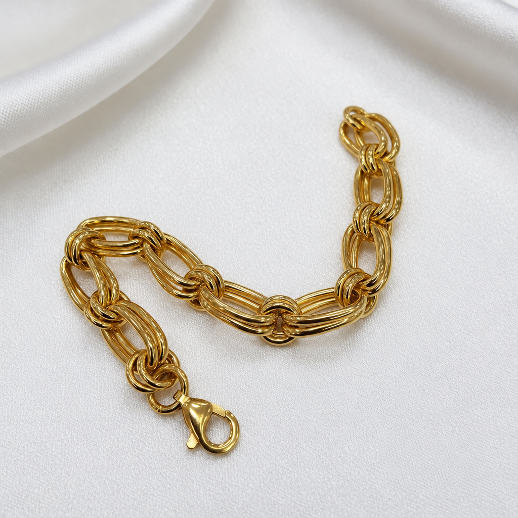 916 gold double link bracelet BR21575 curved on satin with clasp in the foreground
