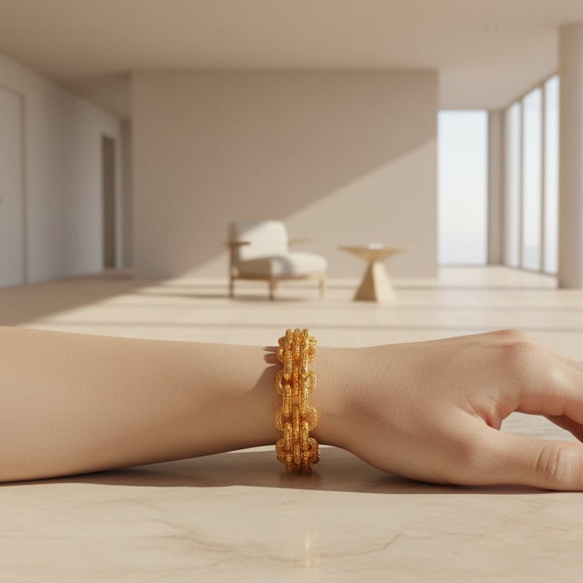 916 gold Double Link Bracelet worn on a wrist in a sunlit room