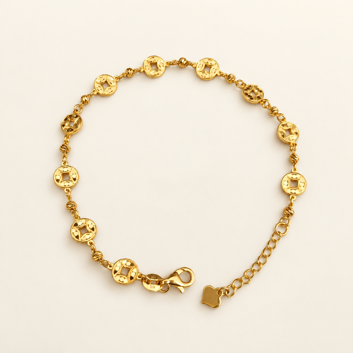 Flat view of the 916 gold Geometric Round Bracelet with extension chain, end tag and lobster clasp