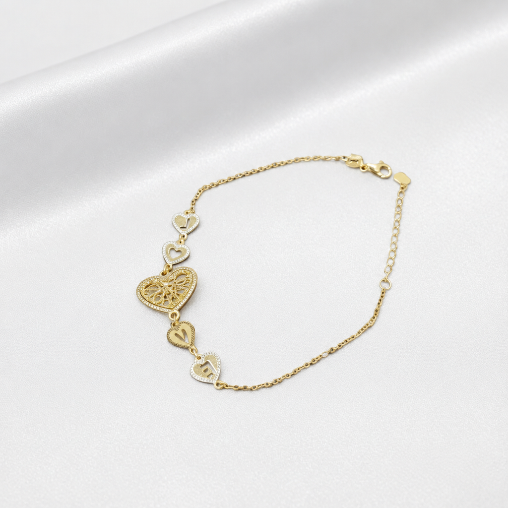 Angled view of BR20620 22K gold Golden Heart Chain Bracelet with filigree centre heart and smaller letter-heart links
