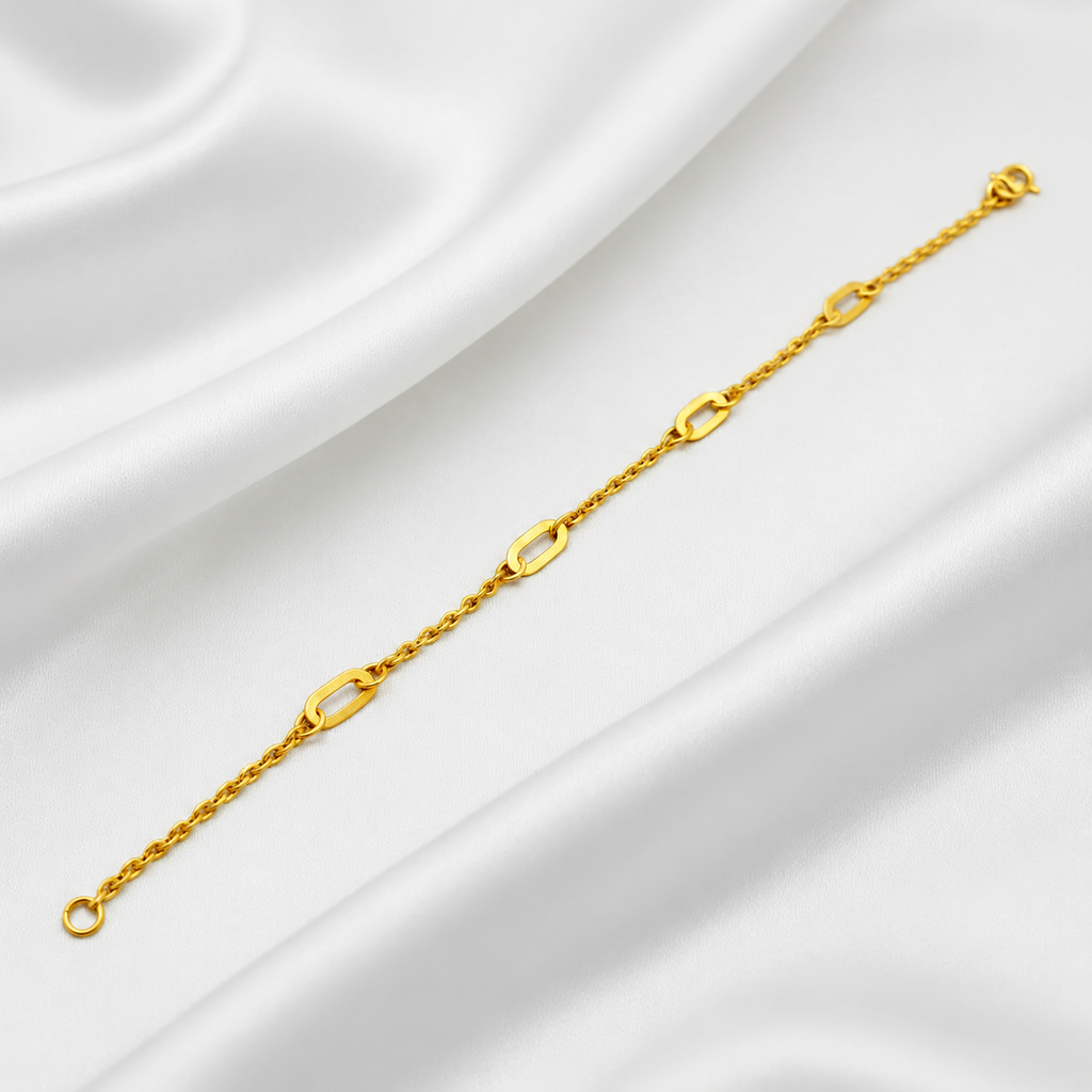 Guild Bullion 916 gold Golden Link Charm Bracelet extended on white satin, showing elongated open links and lobster clasp