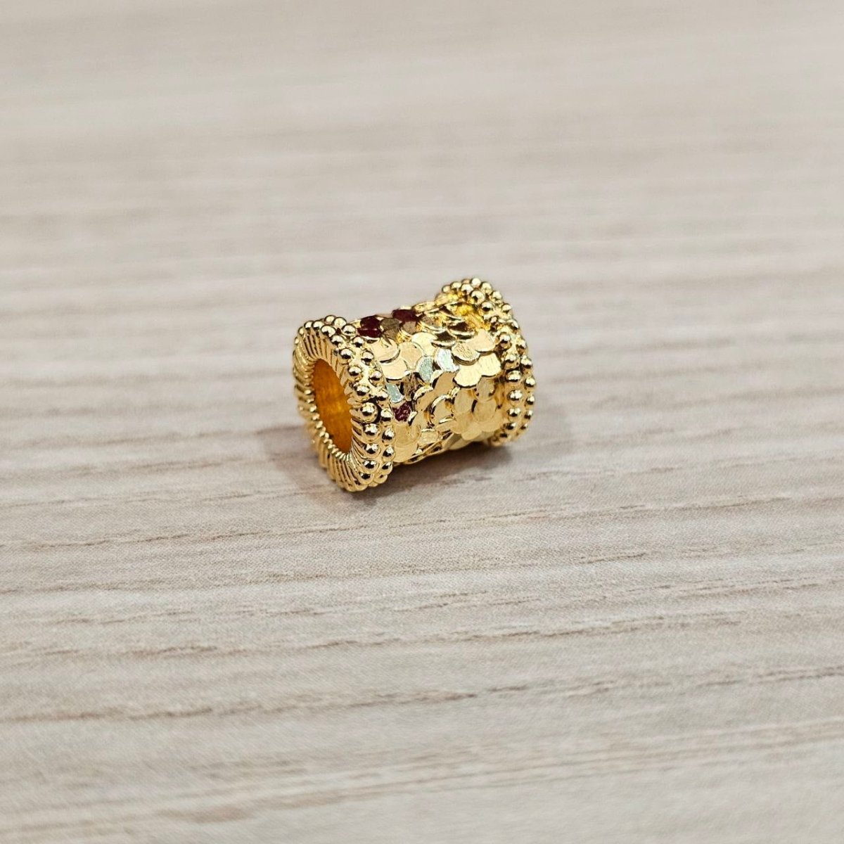 Guild Bullion 916 gold decorated barrel bead; collection design reference. Check selector for current options and availability.