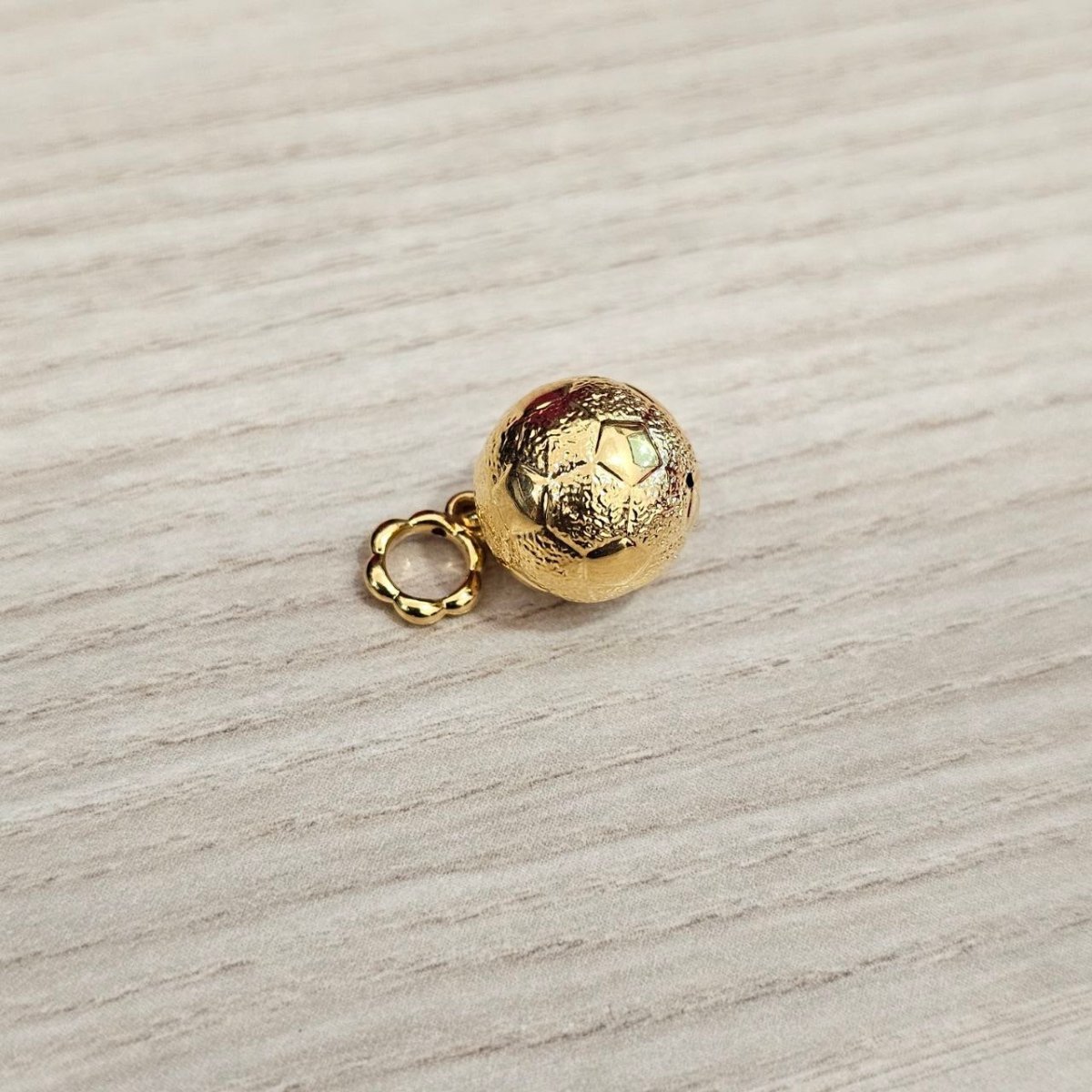Guild Bullion 916 gold faceted ball charm; collection design reference. Check selector for current options and availability.