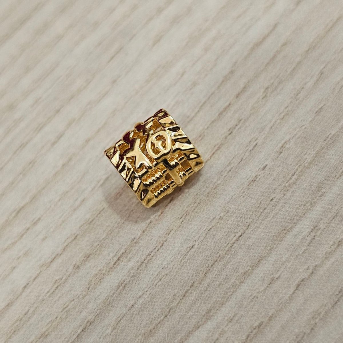 Guild Bullion 916 gold square character bead; collection design reference. Check selector for current options and availability.