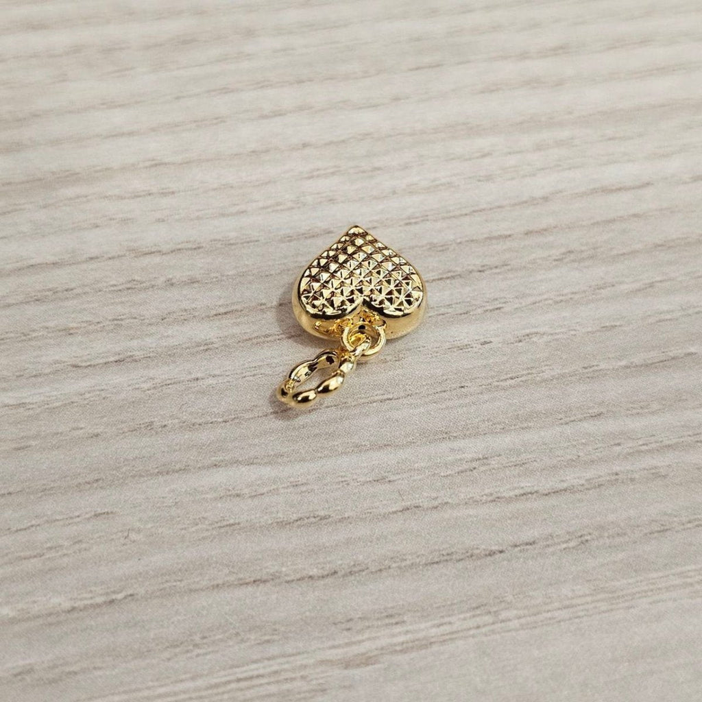 Guild Bullion 916 gold textured heart charm; collection design reference. Check selector for current options and availability.