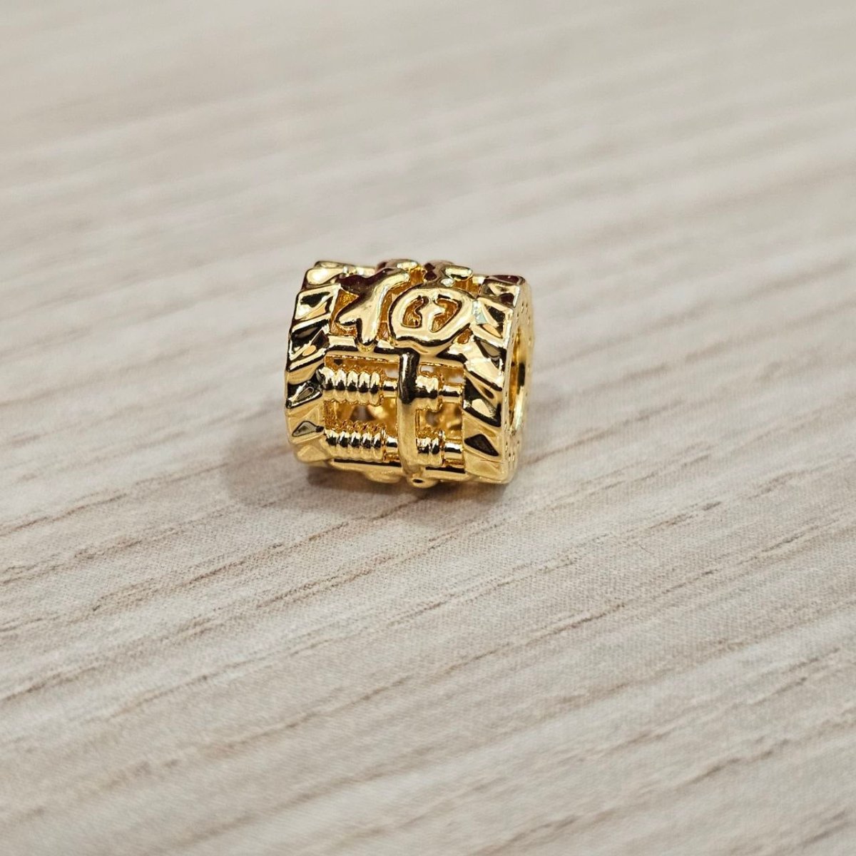 Guild Bullion 916 gold square character bead; collection design reference. Check selector for current options and availability.