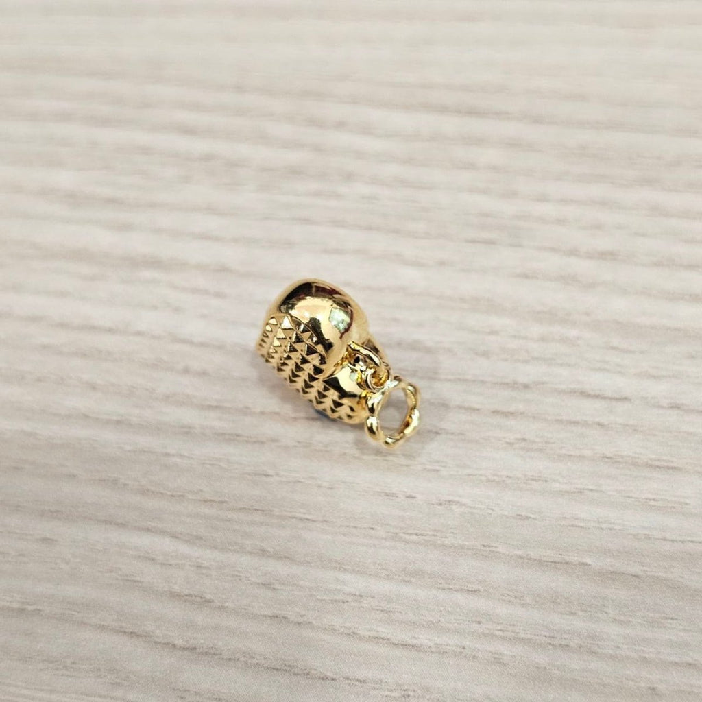 Guild Bullion 916 gold cutout ball charm; collection design reference. Check selector for current options and availability.