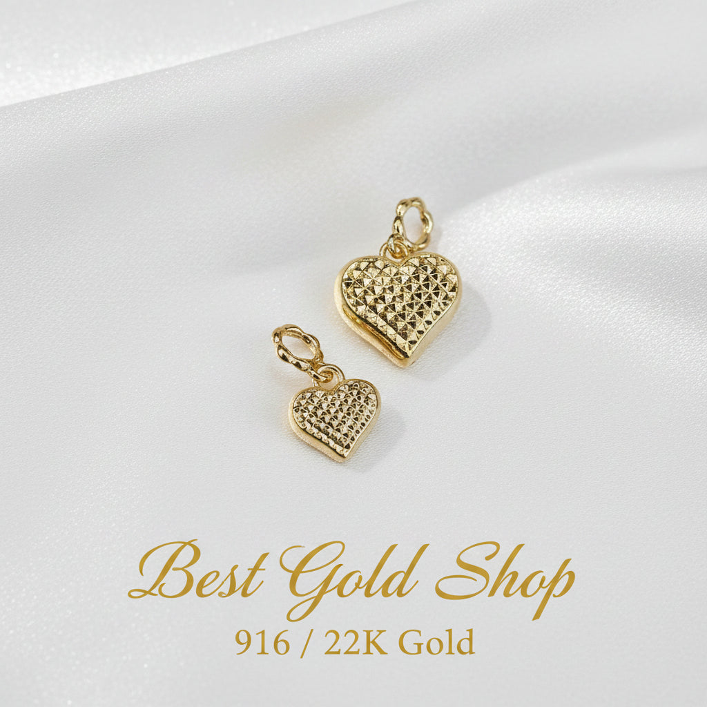 Guild Bullion 916 gold textured heart pair; collection design reference. Check selector for current options and availability.